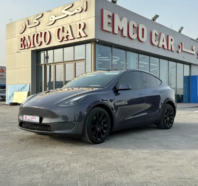 tesla model Y at emco cars showroom used cars dealer in Abu Dhabi